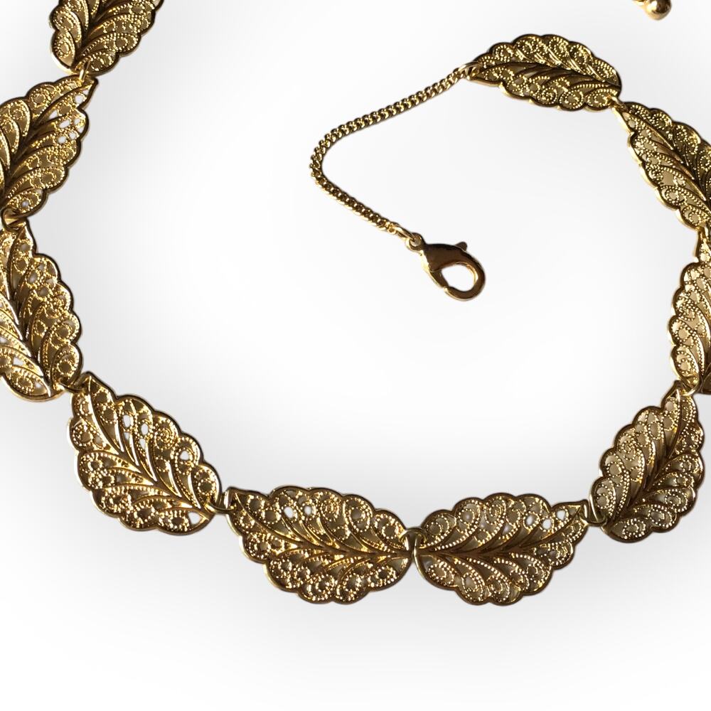 Delicate golden leaf filigree collar necklace